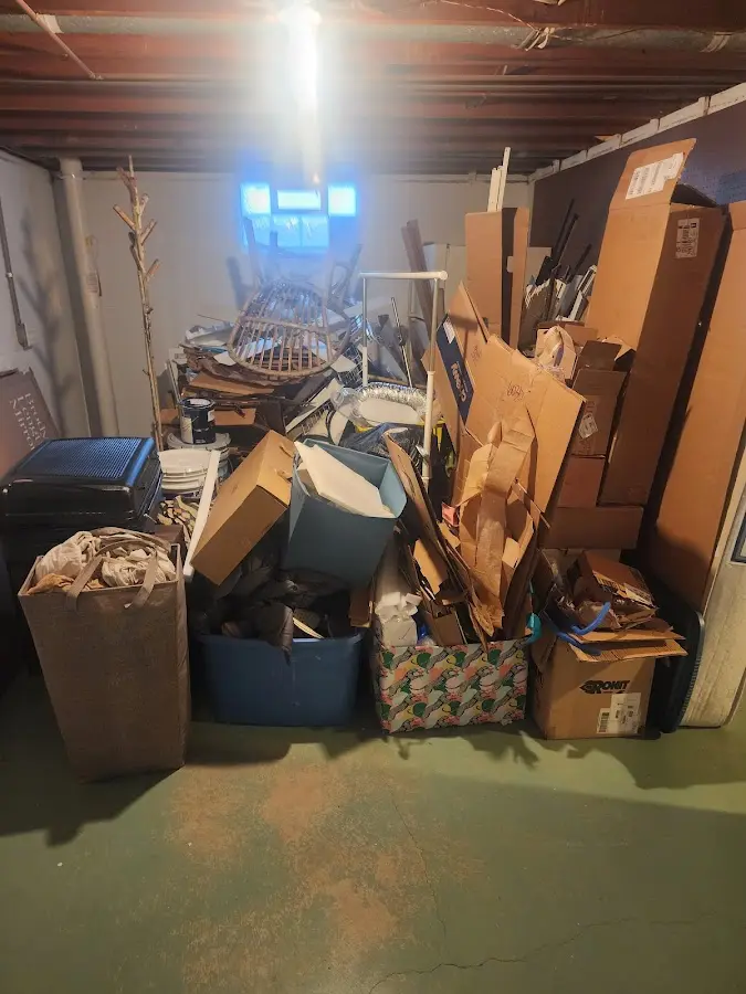 Roll-off dumpster container at job site for Yard Waste Dumpster Rental in Sunapee